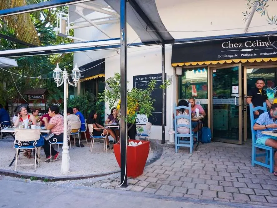 People dining outside at Chez Celine Playa del Carmen