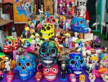 An assortment of colorful ceramic Mexican skulls