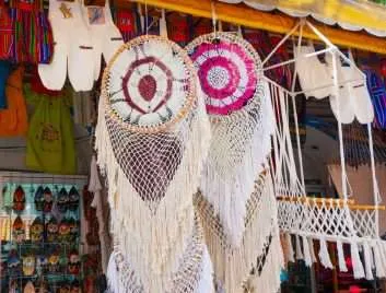 Hand woven dreamcatchers hanging at a souvenir shop in Mexico