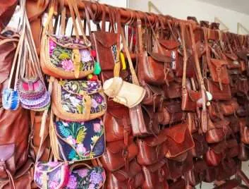 An assortment of leather bags and purses at a souvenir shop in Mexico