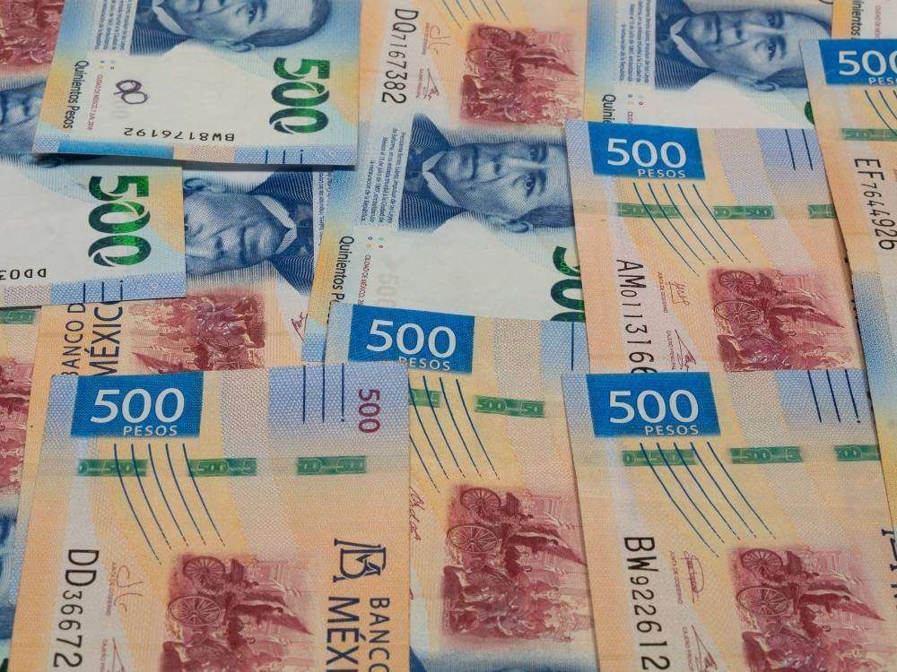 A pile of blue $500 Mexican peso bills