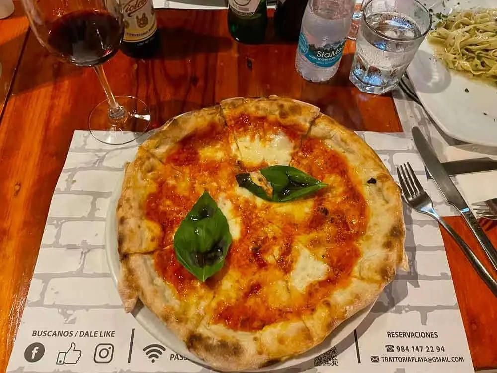 A plate of Margarita pizza at Trattoria del Centro Playa del Carmen