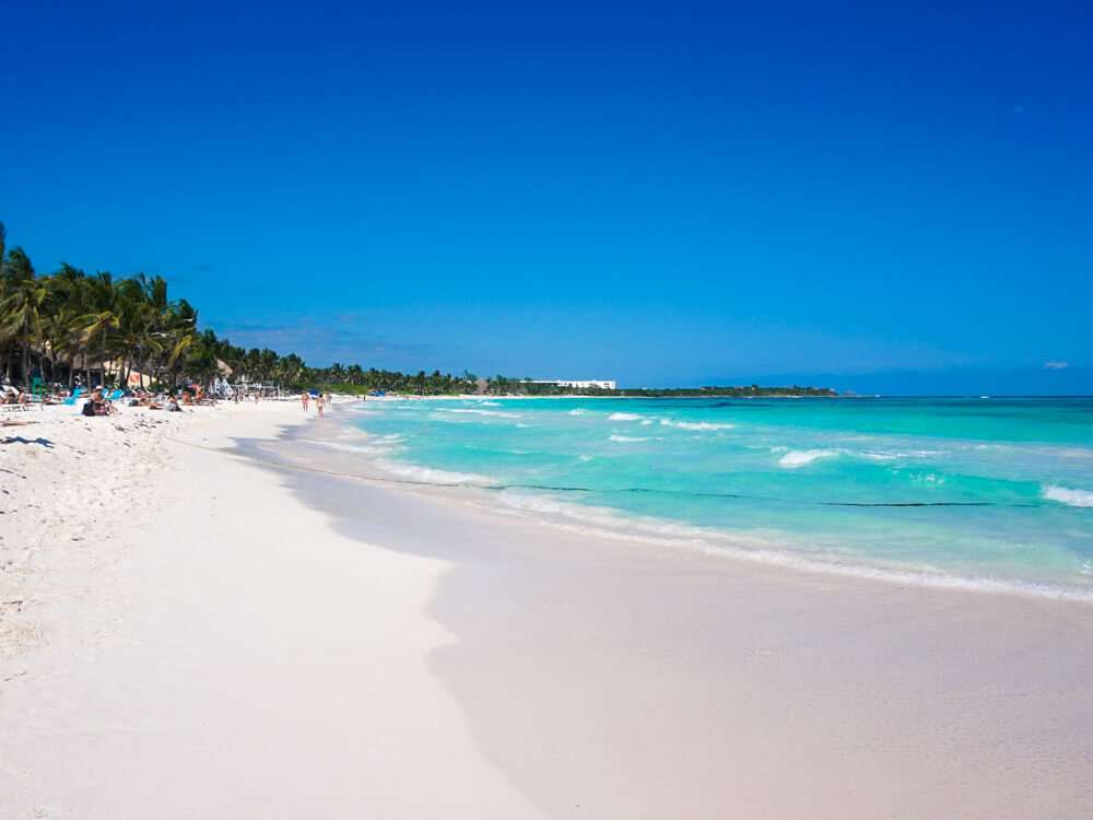 Playa Xpu Ha beach in Playa del Carmen Mexico with palm trees and turquoise water