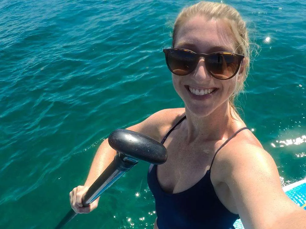Me holding a paddle during a Playa del Carmen paddle boarding session