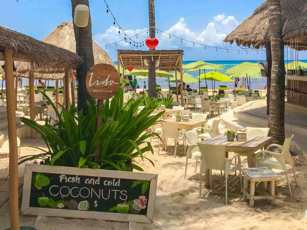 Chairs and tables on the beach at Lido Beach Club Playa del Carmen