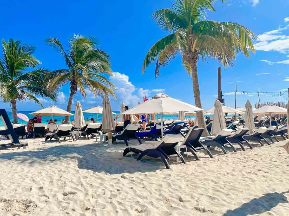 Lounge chairs and beach umbrellas at Martina Beach Club Playa del Carmen