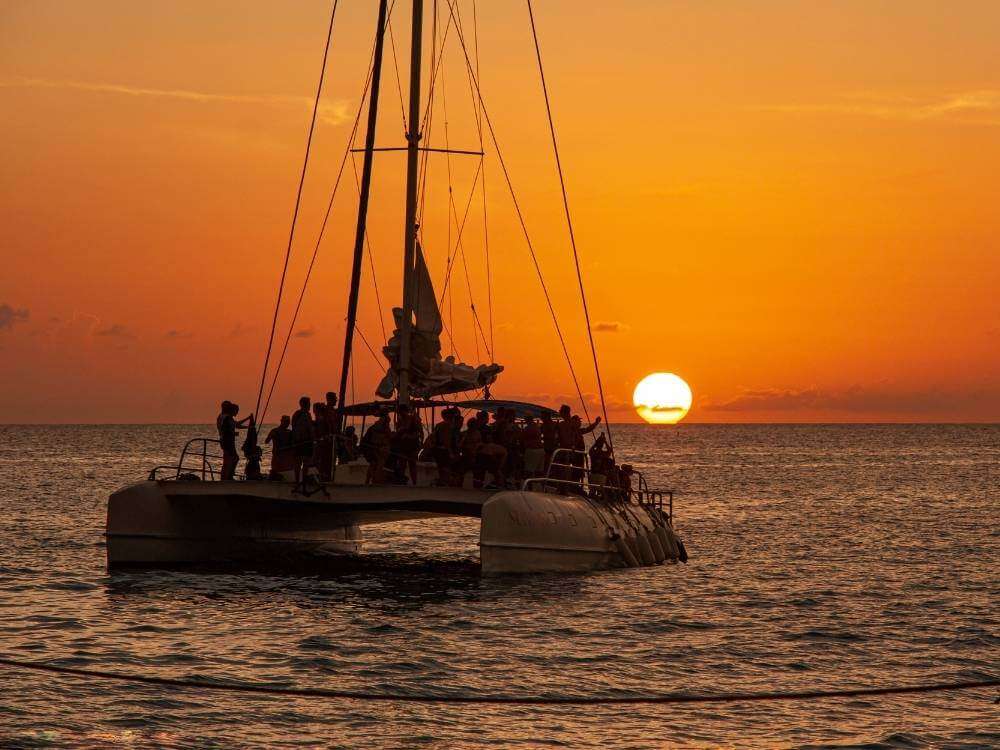 A group of people on a sunset catamaran on Playa Maroma