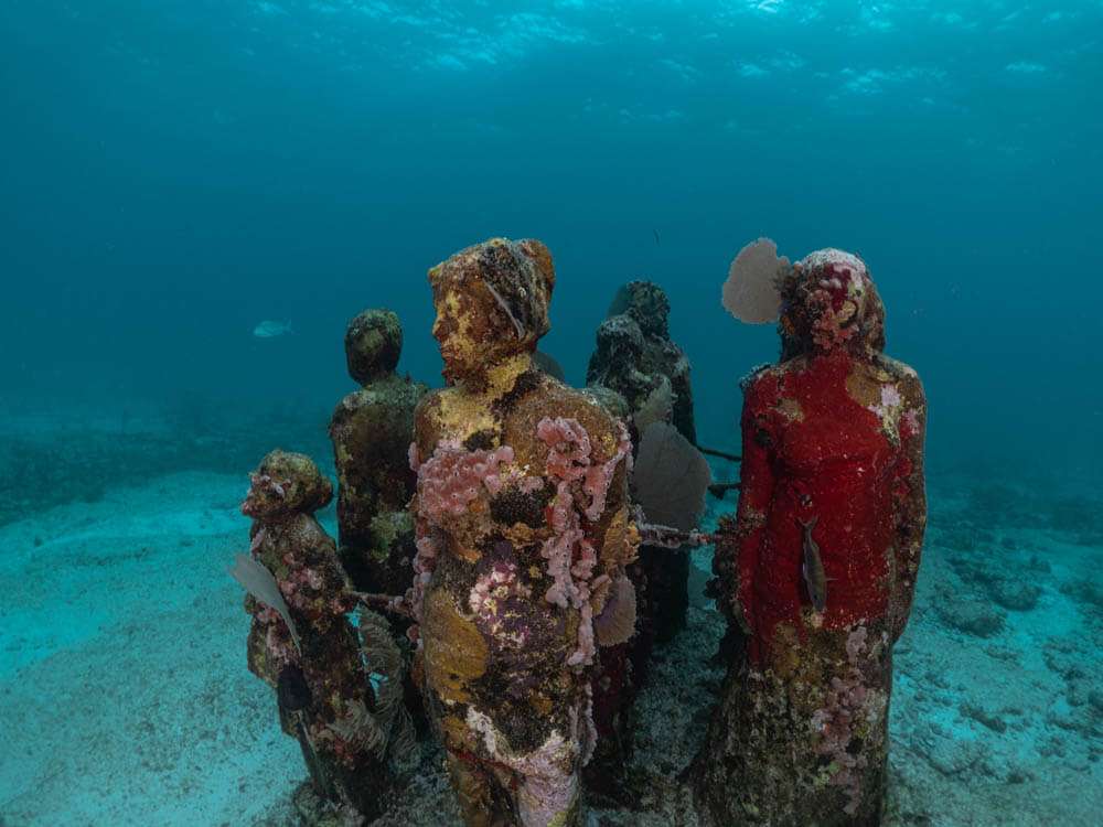 Statues underwater at the Isla Mujeres MUSA Underwater Museum of Art