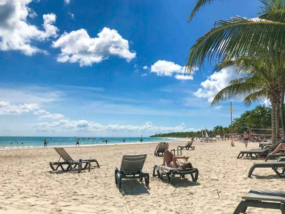 Lounge beds on the beach at Catalonia Playa Maroma Resort