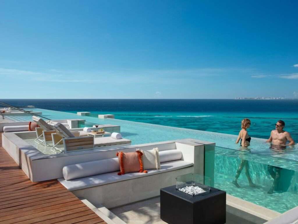 An infinity pool overlooking the ocean at Impression Isla Mujeres by Secrets