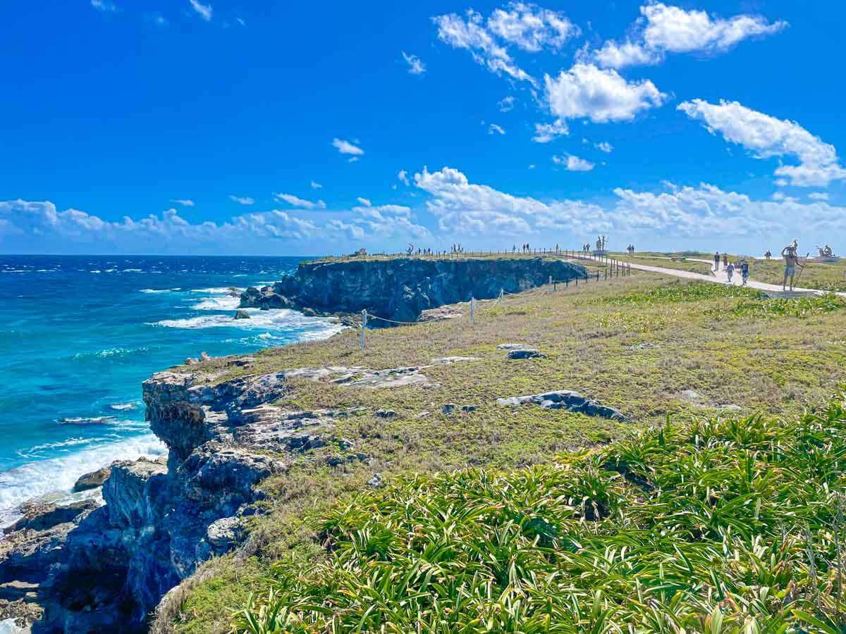 Punta Sur, the southern tip of Isla Mujeres with cliffs, grass, and the ocean next to it