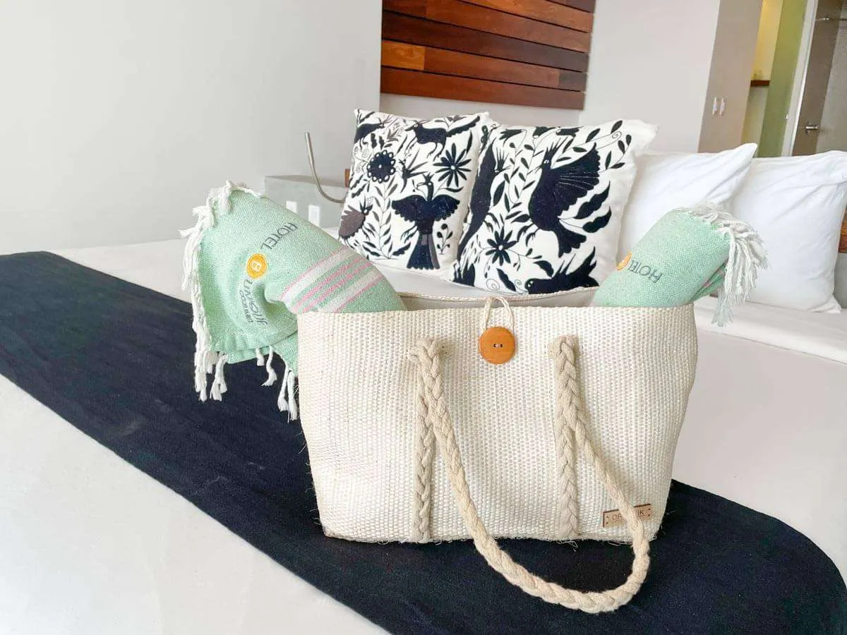 Beach bag and towels provided for guests to use during stay at Hotel B Unique
