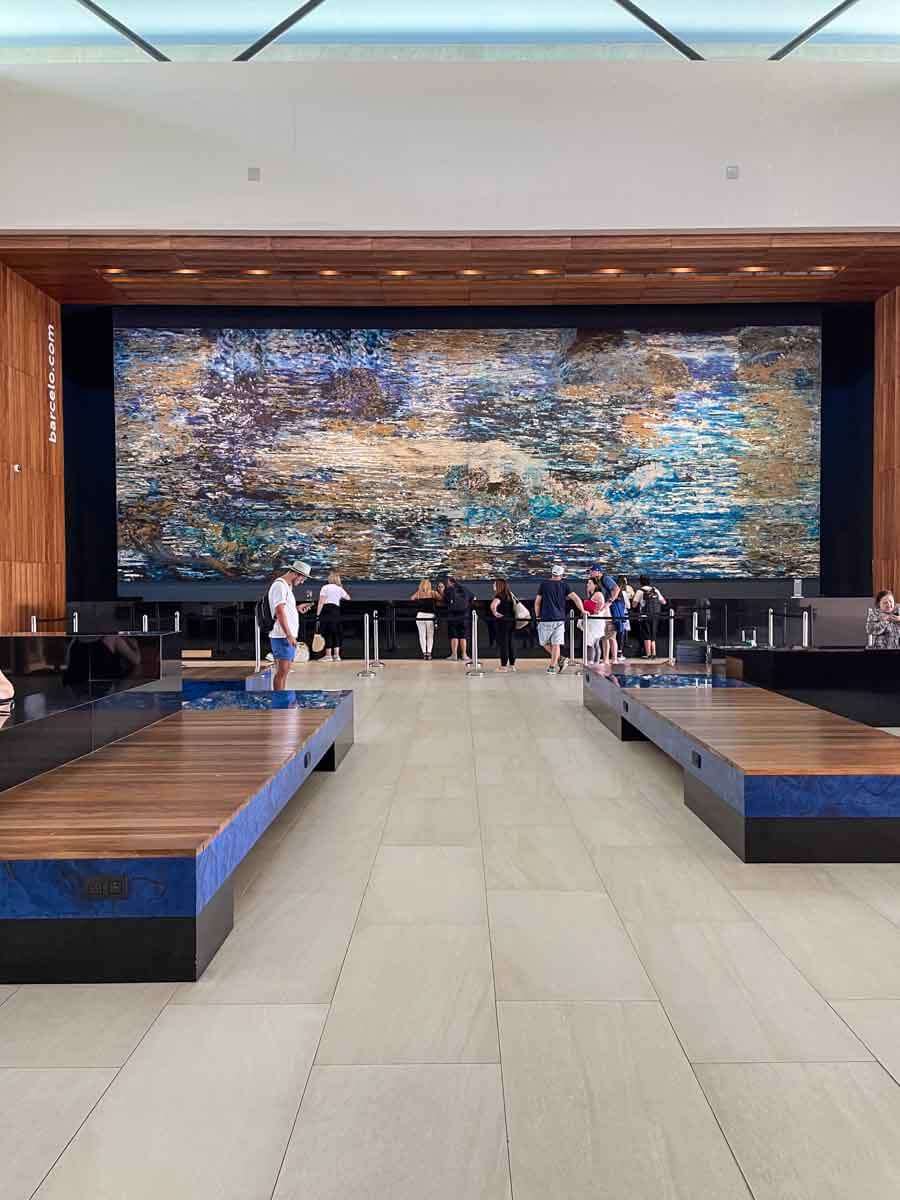 The Front Desk at Barcelo Maya Riviera resort with a large painting above it