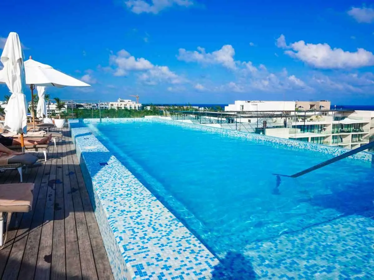 The rooftop pool at the Reef 28 overlooking buildings in Playa del Carmen