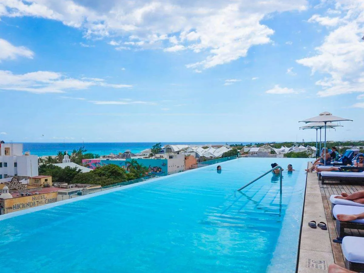 The rooftop pool at The Fives Downtown overlooking Playa del Carmen