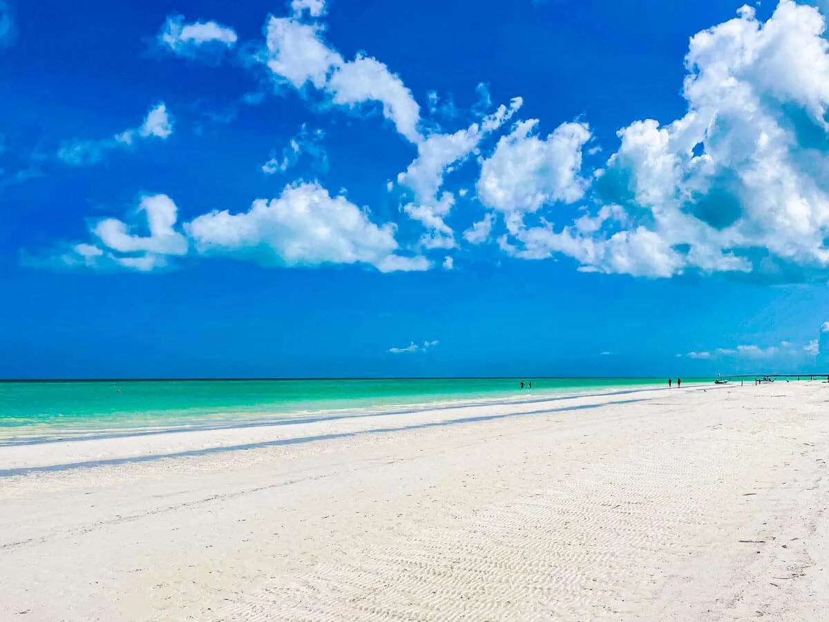 A flat and widespread beach in Holbox Mexico with white sand and turquoise water