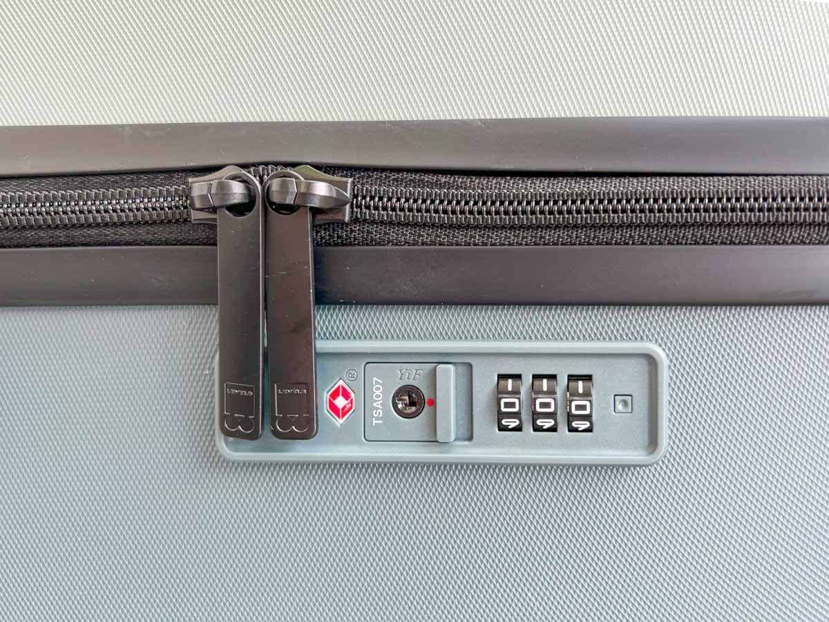 A close up of the TSA-Approved Lock and zippers on the Level8 Voyageur suitcase
