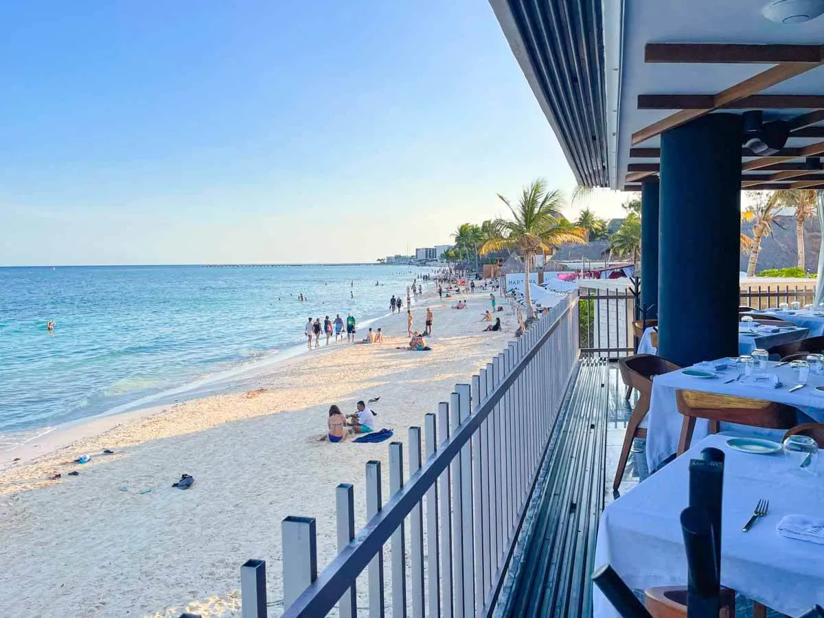 Tables and chairs next to the beach at Piaggia Beachfront Restaurant Playa del Carmen