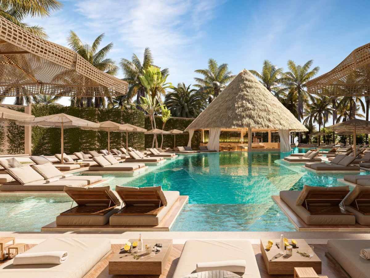Lounge beds and umbrellas by the pool at Almare, a Luxury Collection Adult All-Inclusve Resort, Isla Mujeres
