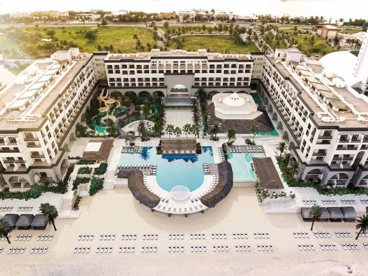 An aerial view of the pools and resort building at Marriott Cancun, An All-Inclusive Resort