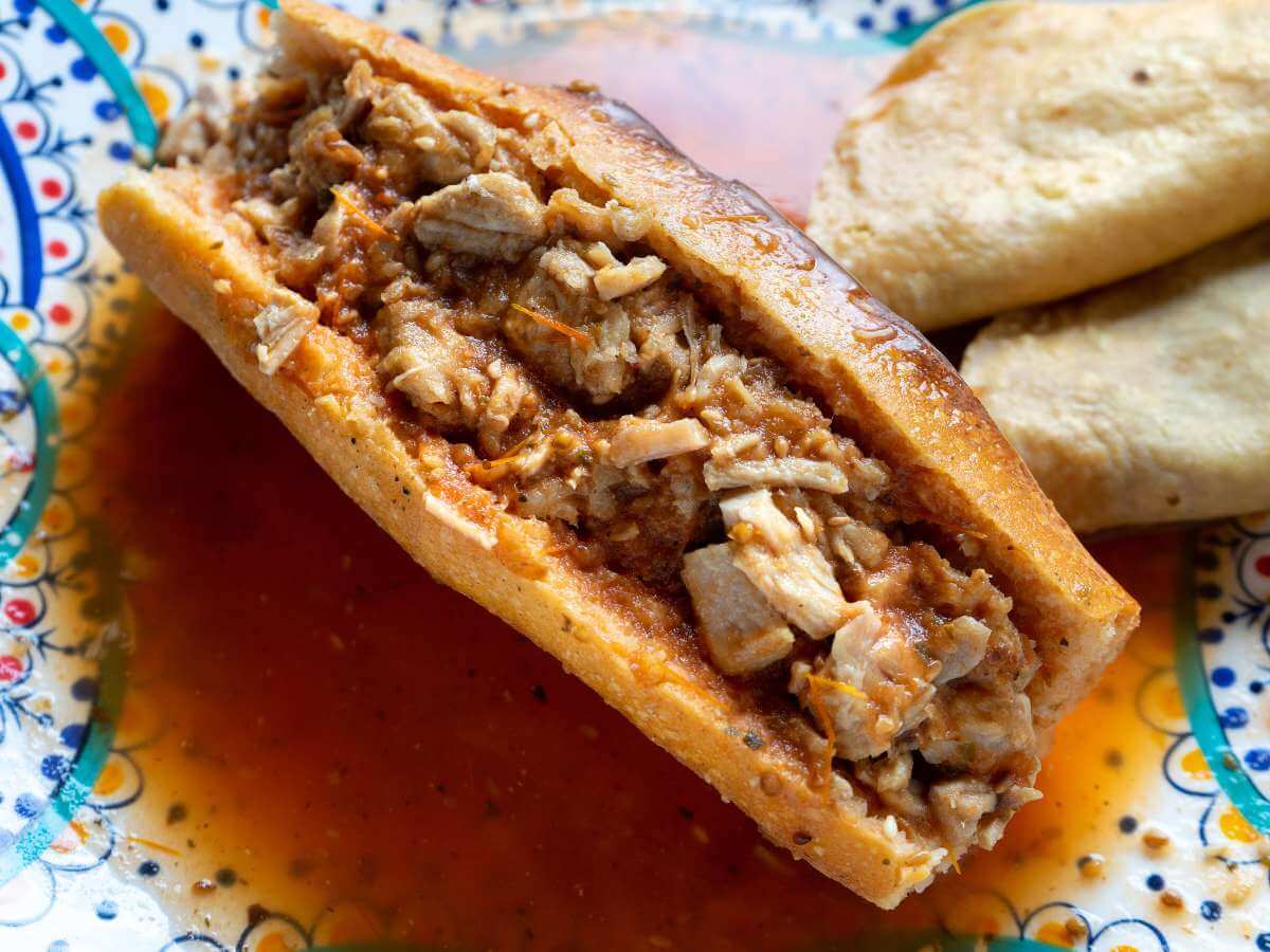 A plate of torta ahogada drowned sandwich from Guadalajara Mexico