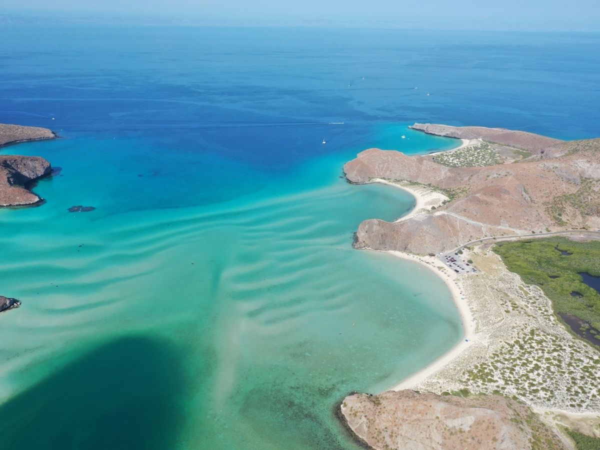 An aerial view of Playa Balandra with turquoise water in Baja California Sur