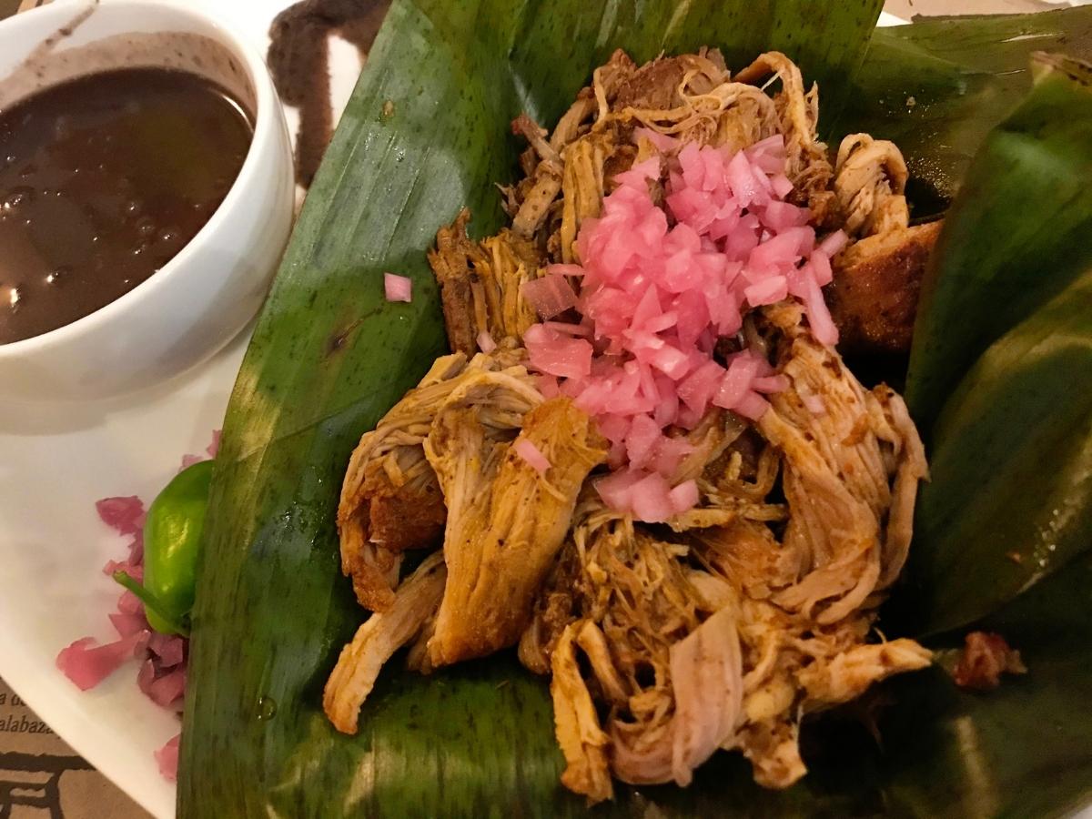 A plate of Poc Chuc, a traditional Yucatecan pork dish