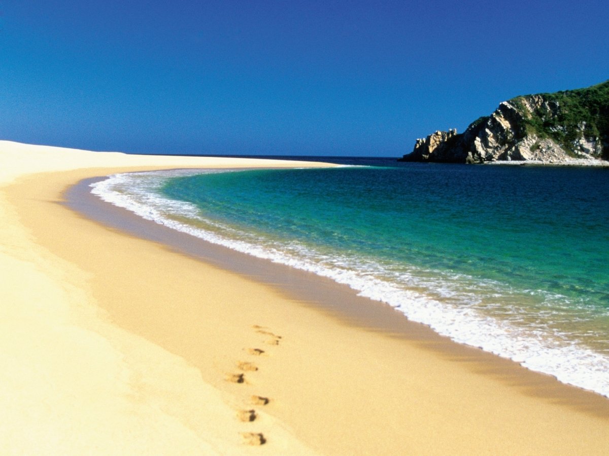 Bahia de Cacaluta beach with golden sand and turquoise water in Oaxaca Mexico